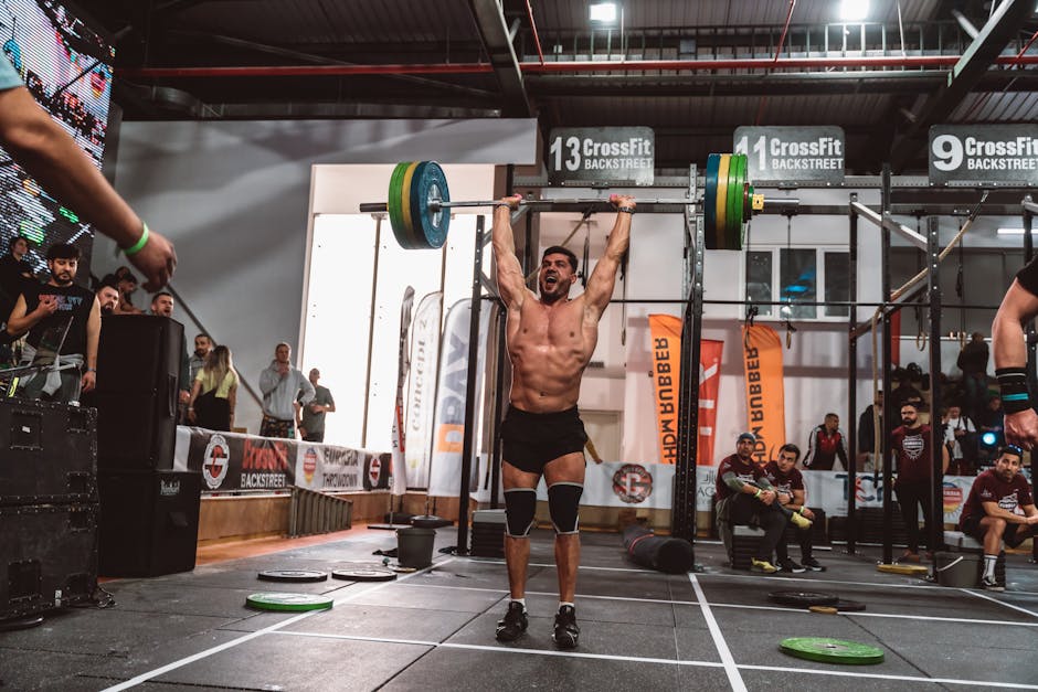 Naim Suleymanoglu 1988 Seoul Olympics weightlifting gold medal celebration crowd cheering barbell overhead