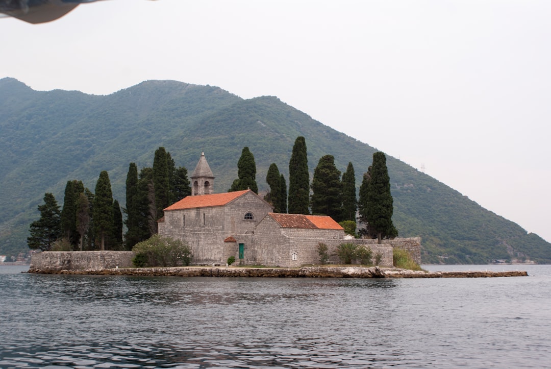 Our Lady of the Rocks island church bay of Kotor boat approach