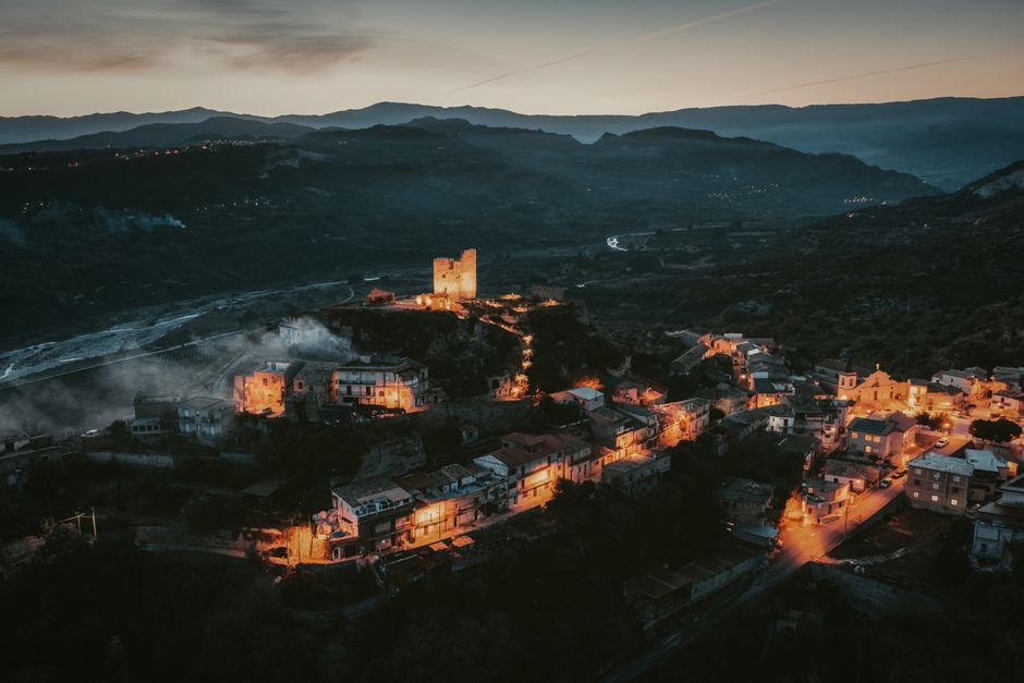 Prizren cityscape from hilltop view of old town and Sharr mountains sunset