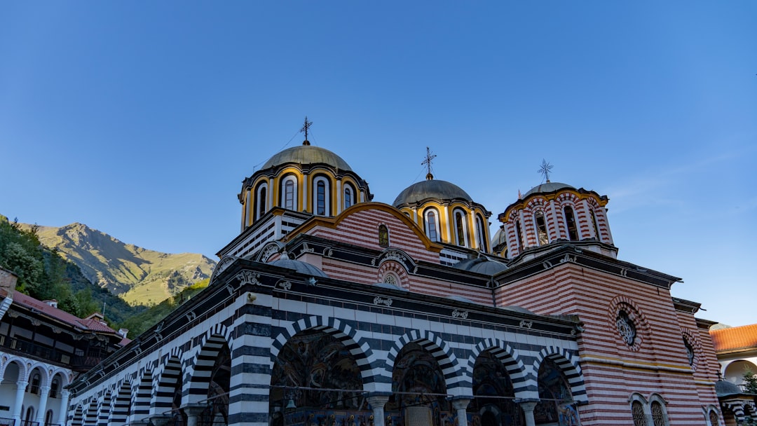 Rila Monastery Bulgaria exterior colorful architecture mountain backdrop