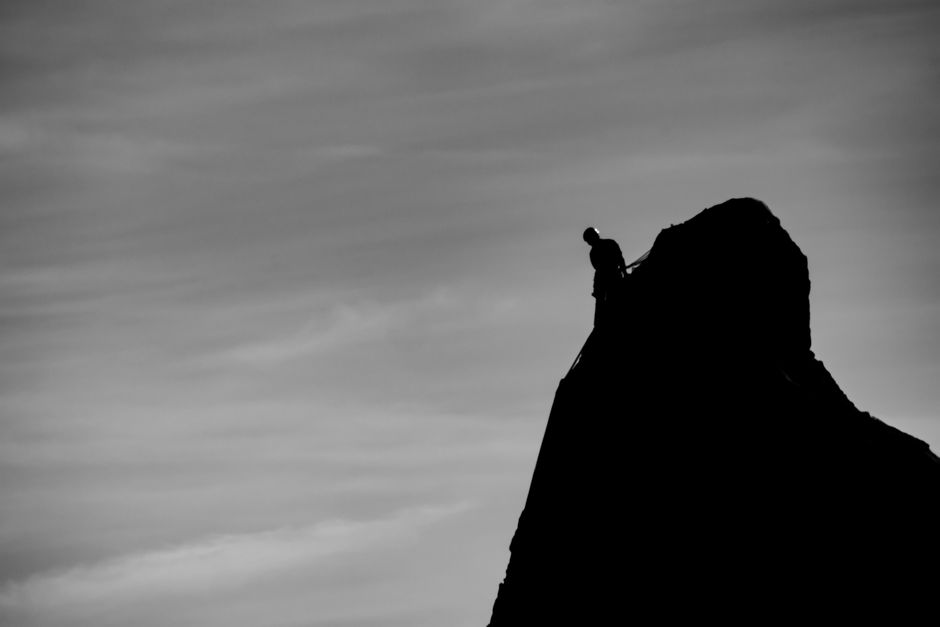 Razor peak Slovenia jagged limestone summit rope climb dramatic sky