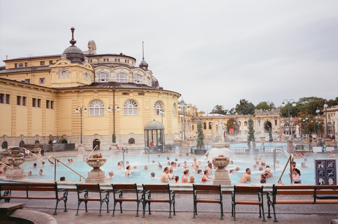 Széchenyi Thermal Bath Budapest yellow limestone facade outdoor pools steam